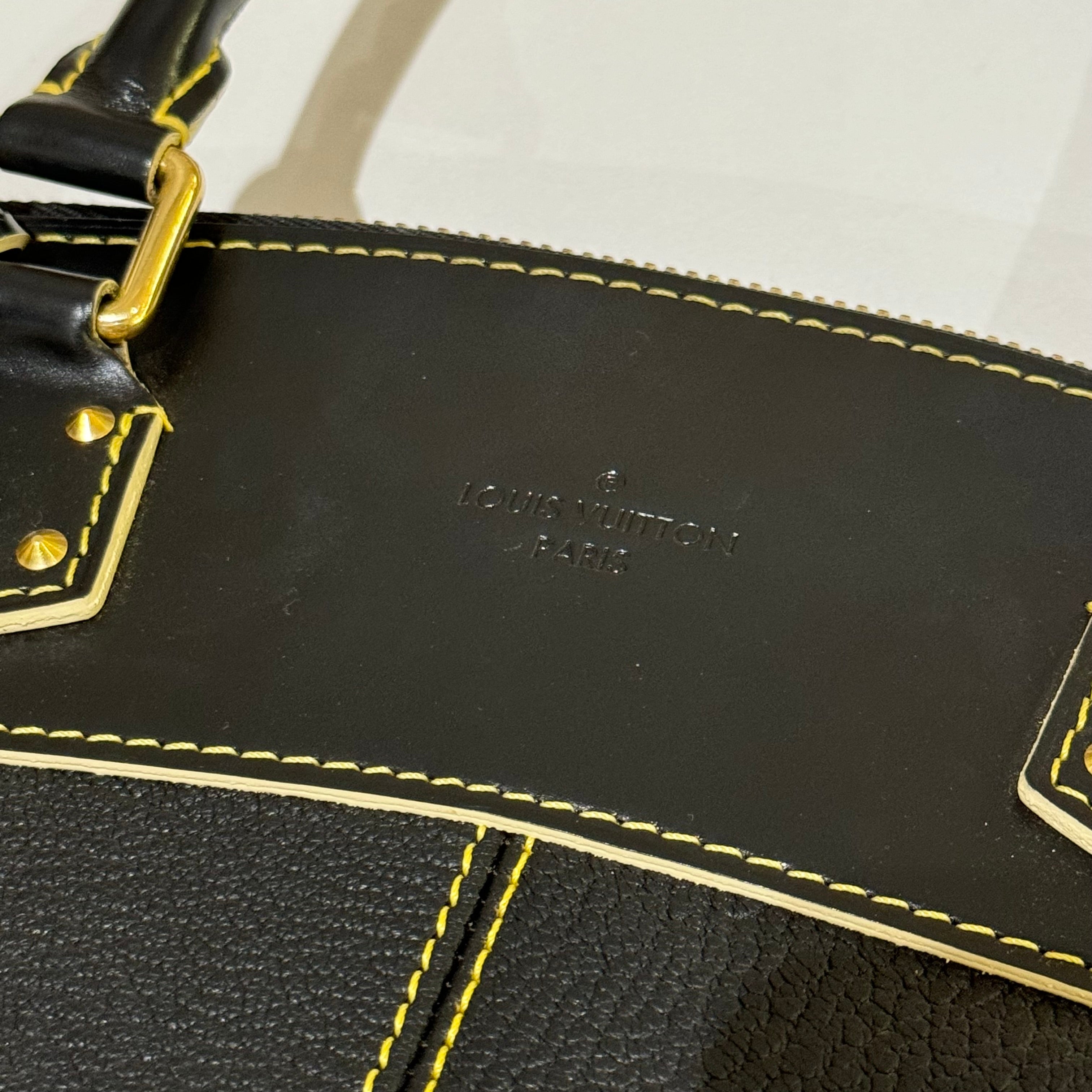 LOUIS VUITTON SUHALI LOCK IT MM