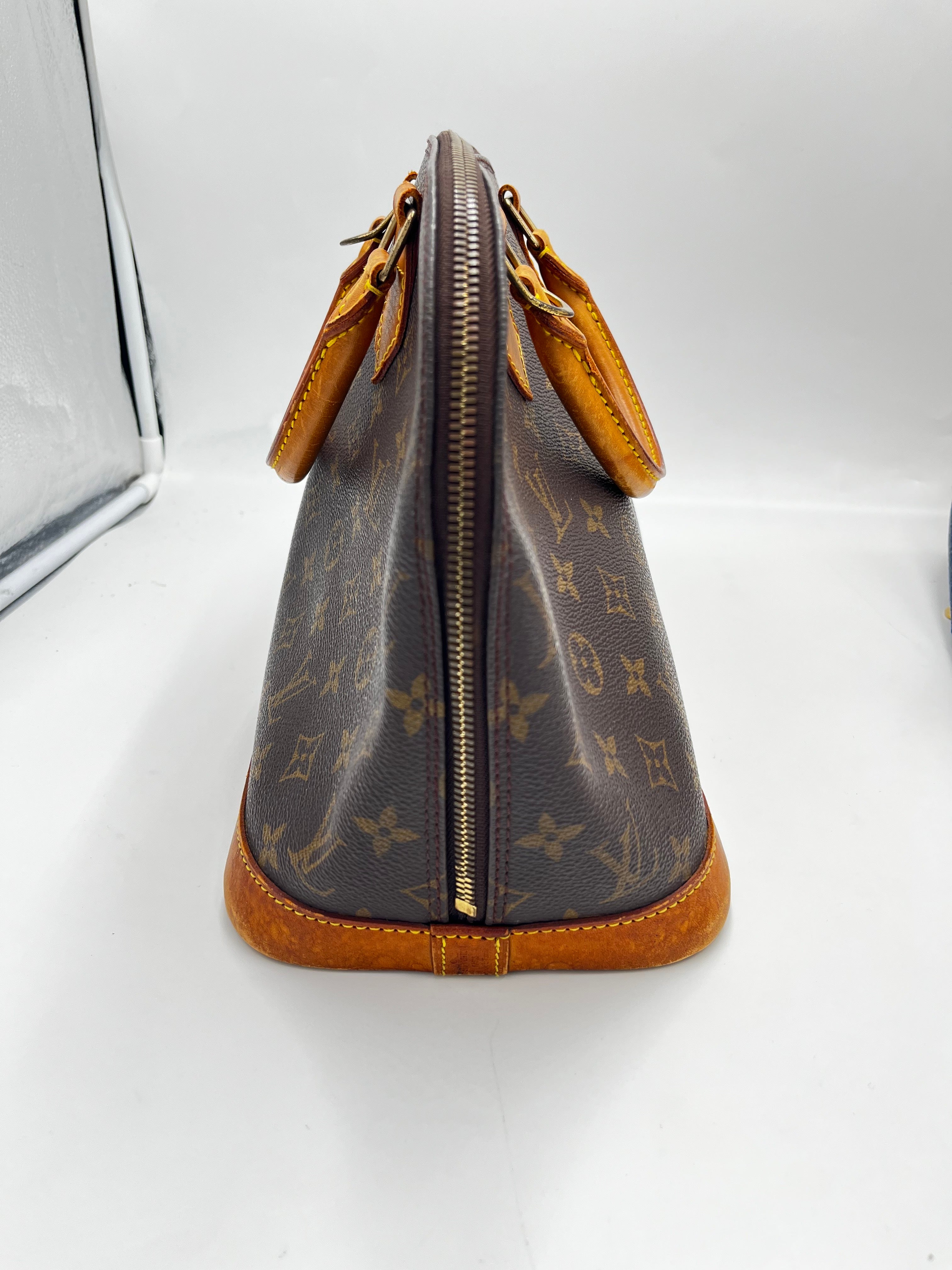 Louis Vuitton Alma Handbag Monogram Canvas Brown Canvas Handbag ( )