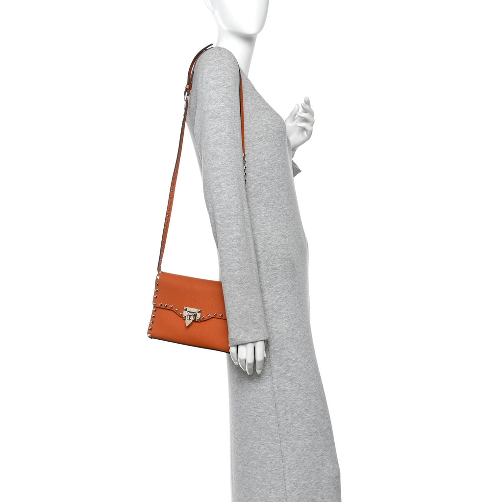 Pebbled Calfskin Medium Rockstud Flip Lock Crossbody Bag Orange