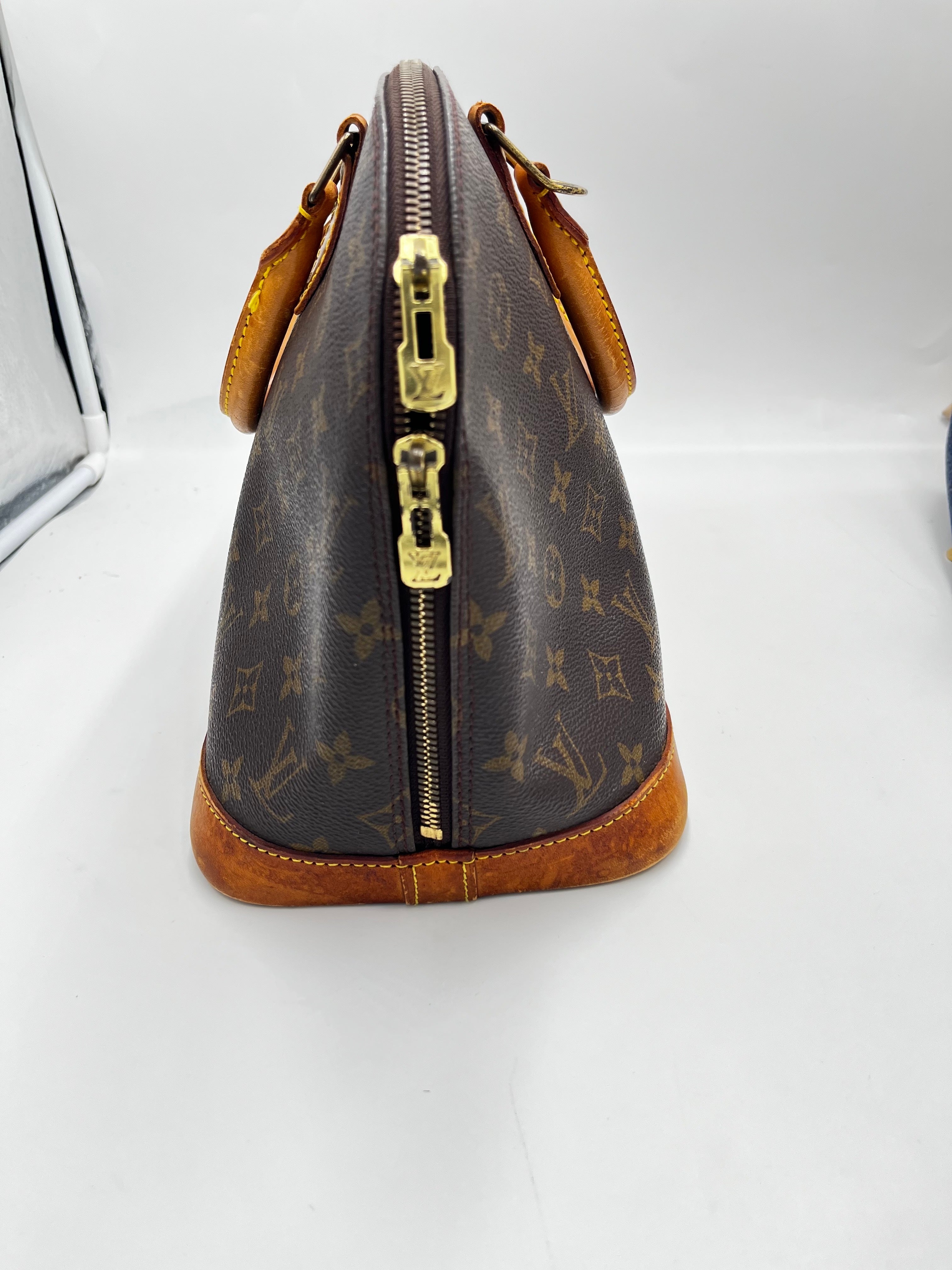 Louis Vuitton Alma Handbag Monogram Canvas Brown Canvas Handbag ( )