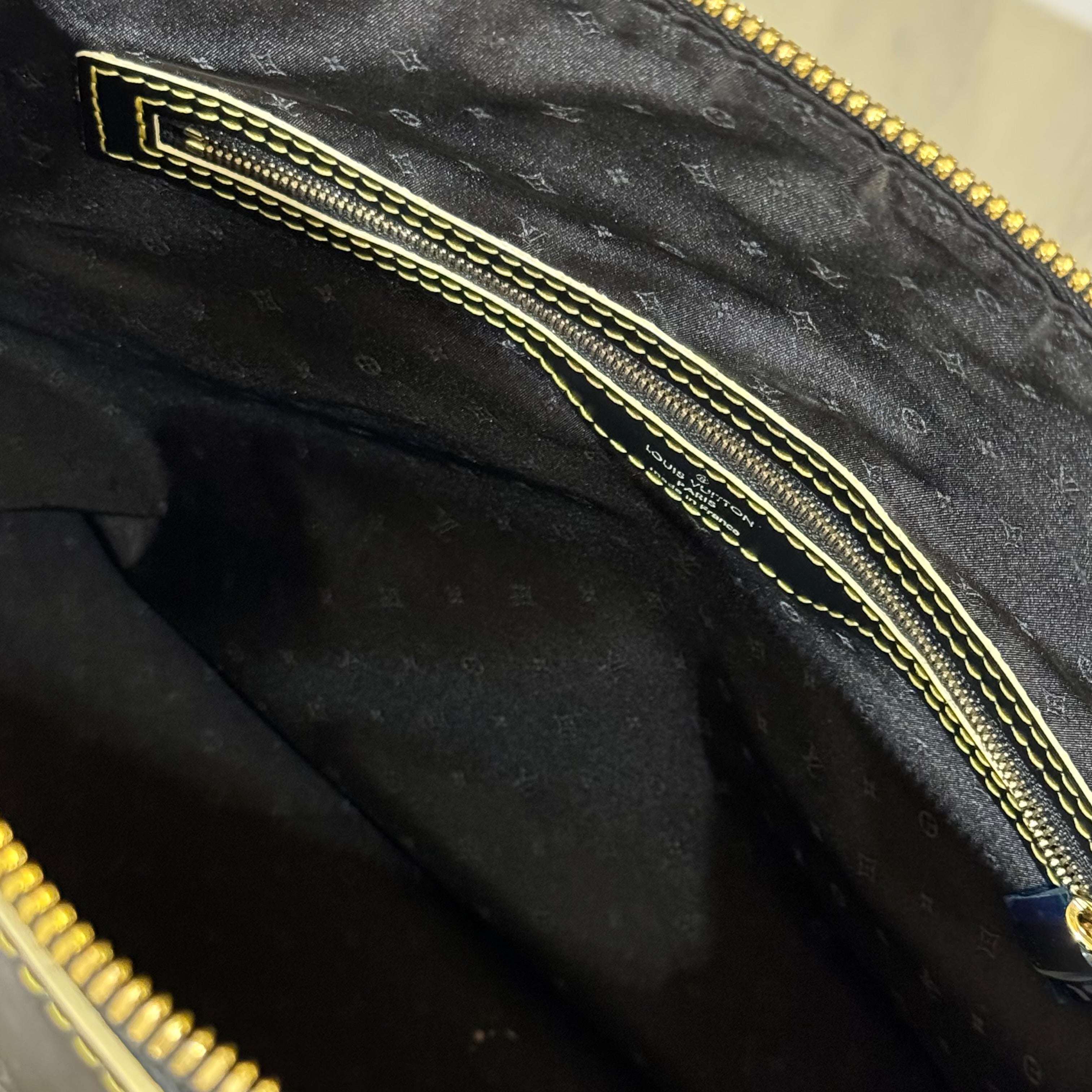 LOUIS VUITTON SUHALI LOCK IT MM