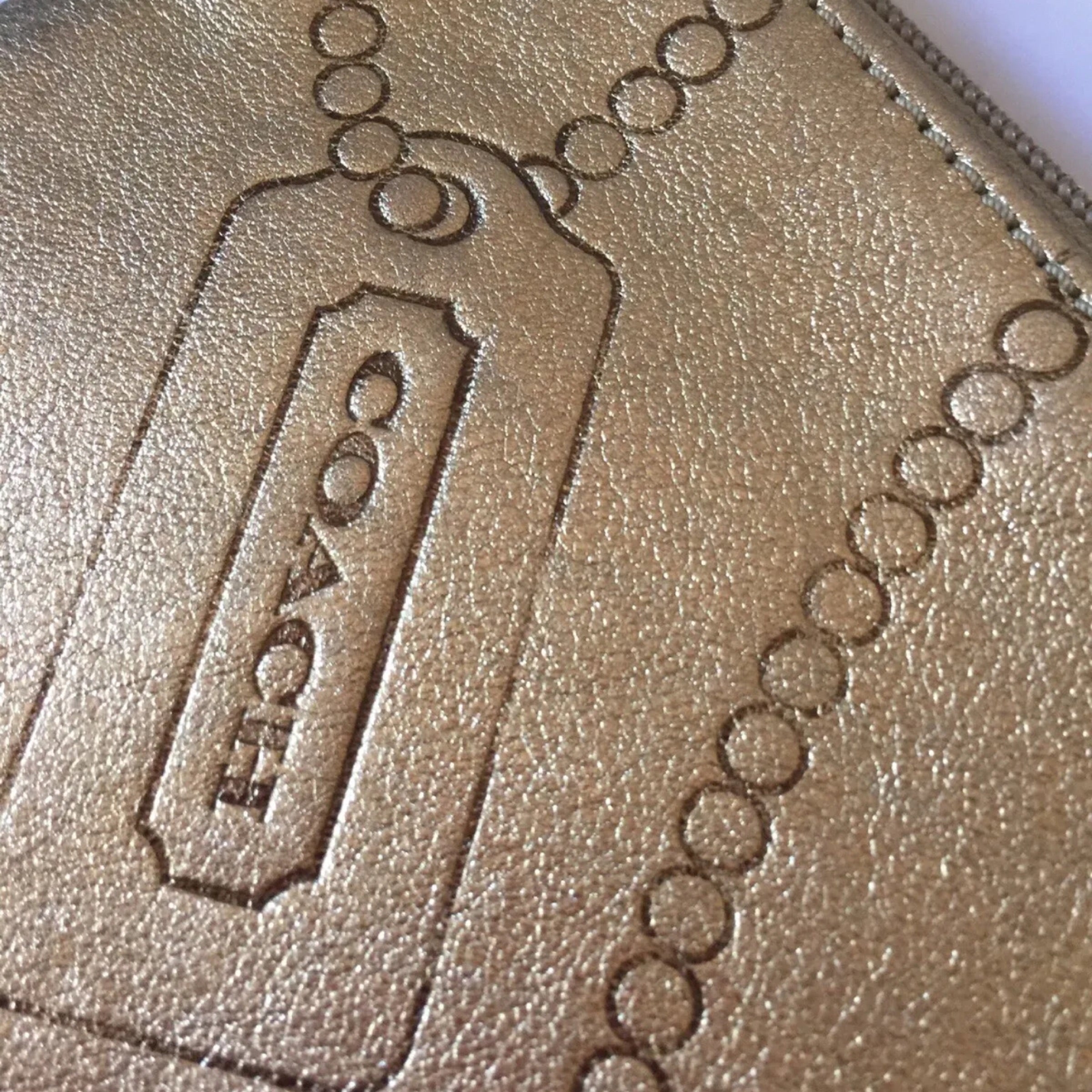 COACH Gold Leather Embossed Wristlet