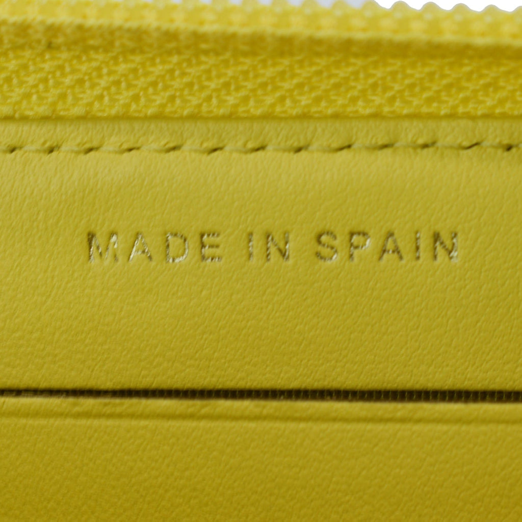 CHANEL Boy Caviar Quilted Zip Around Wallet Yellow