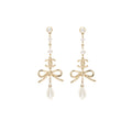 Chanel pearl / cc logo / bow tie drop earrings gold tone