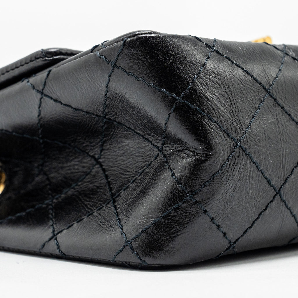 Chanel Mini 2.55 reissue flap bag aged calfskin black