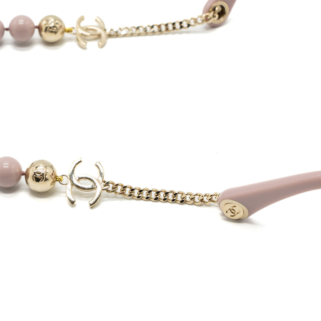Chanel sunglasses with pearl chain pink
