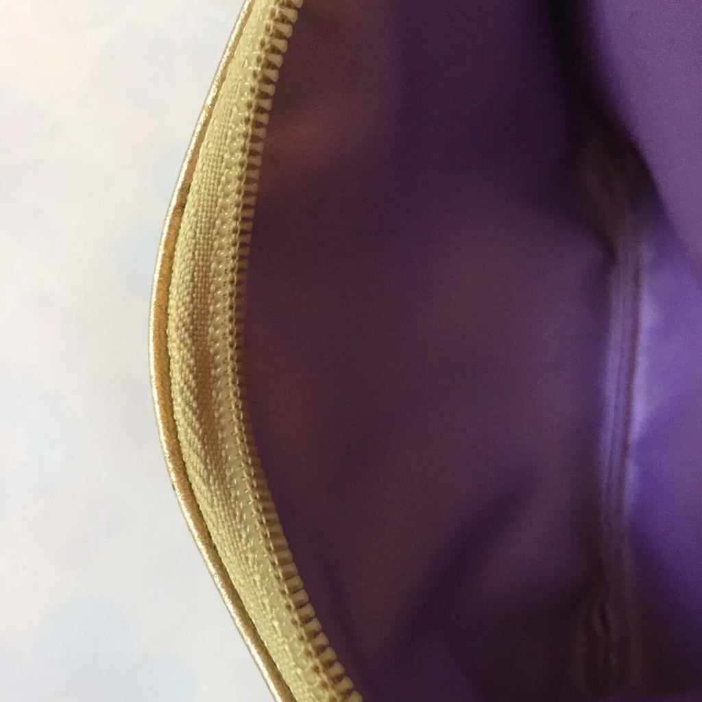 COACH Gold Leather Embossed Wristlet