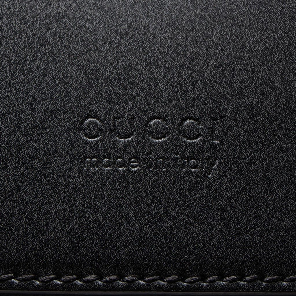 Gucci GG Supreme Medium Flap Backpack