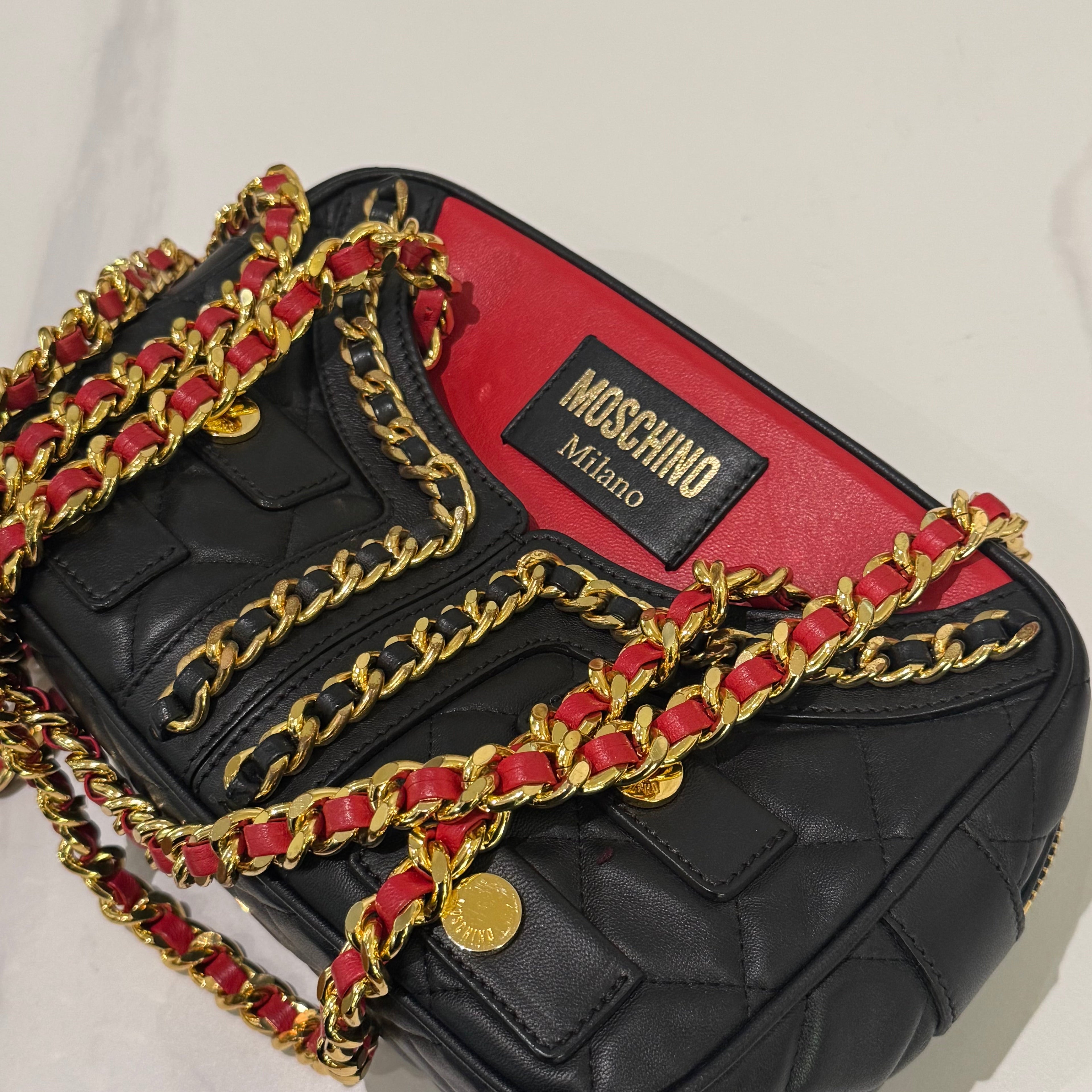 MOSCHINO QUILTED CHAIN BAG WITH CLOTHING MOTIF