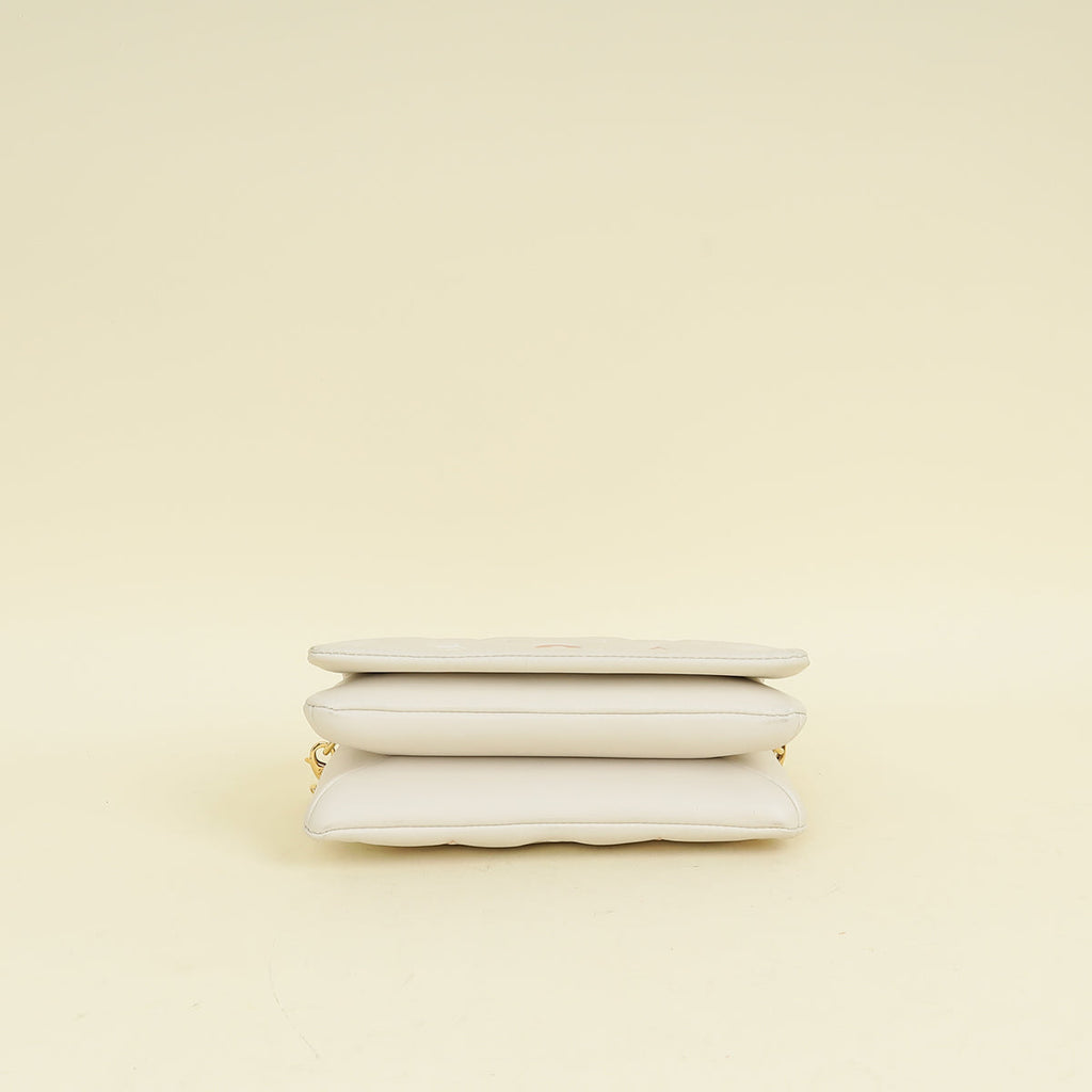 Louis Vuitton Creme Monogram-Embossed Pochette Coussin Bag