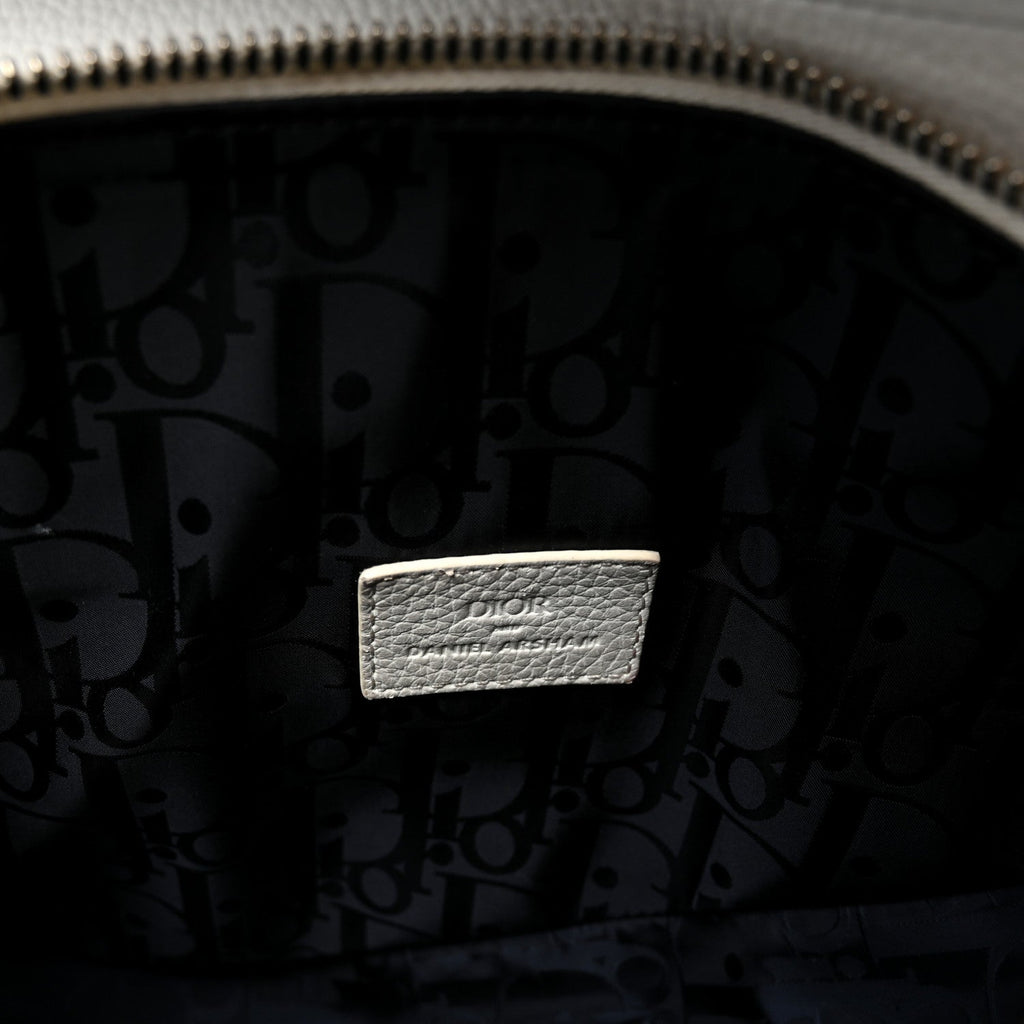 X Daniel Arsham Grained Calfskin Newspaper Print Saddle Bag White