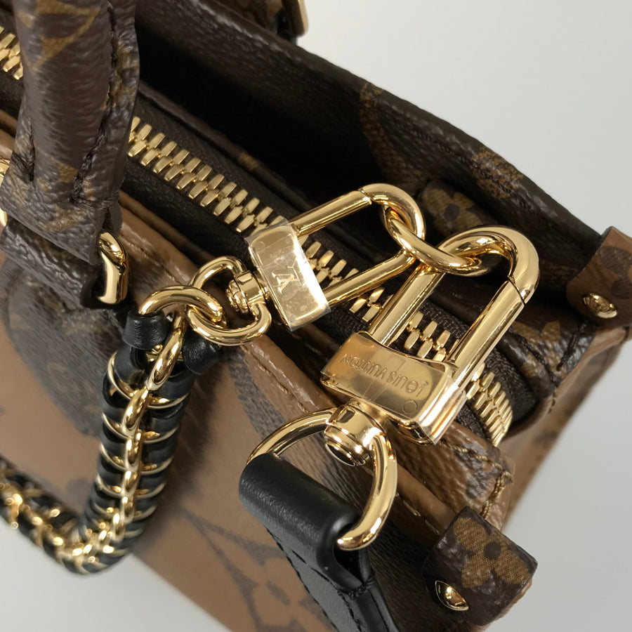 LOUIS VUITTON Monogram Giant Reverse On the Go EW Chain M14236 Hand bag
