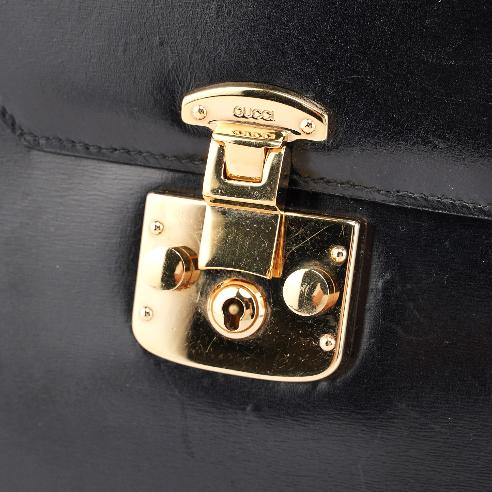 Black Calfskin Ladylock Top Handle Bag