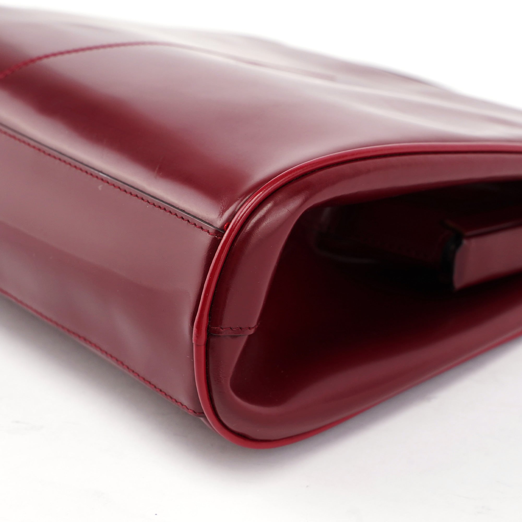 Burgundy Spazzolato Top Handle Clutch Bag