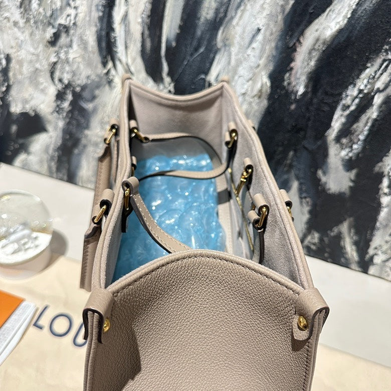 Lv on the go MM calfskin 13130