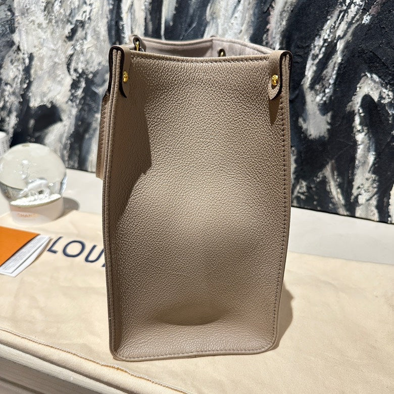 Lv on the go MM calfskin 13130