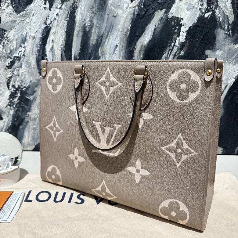 Lv on the go MM calfskin 13130