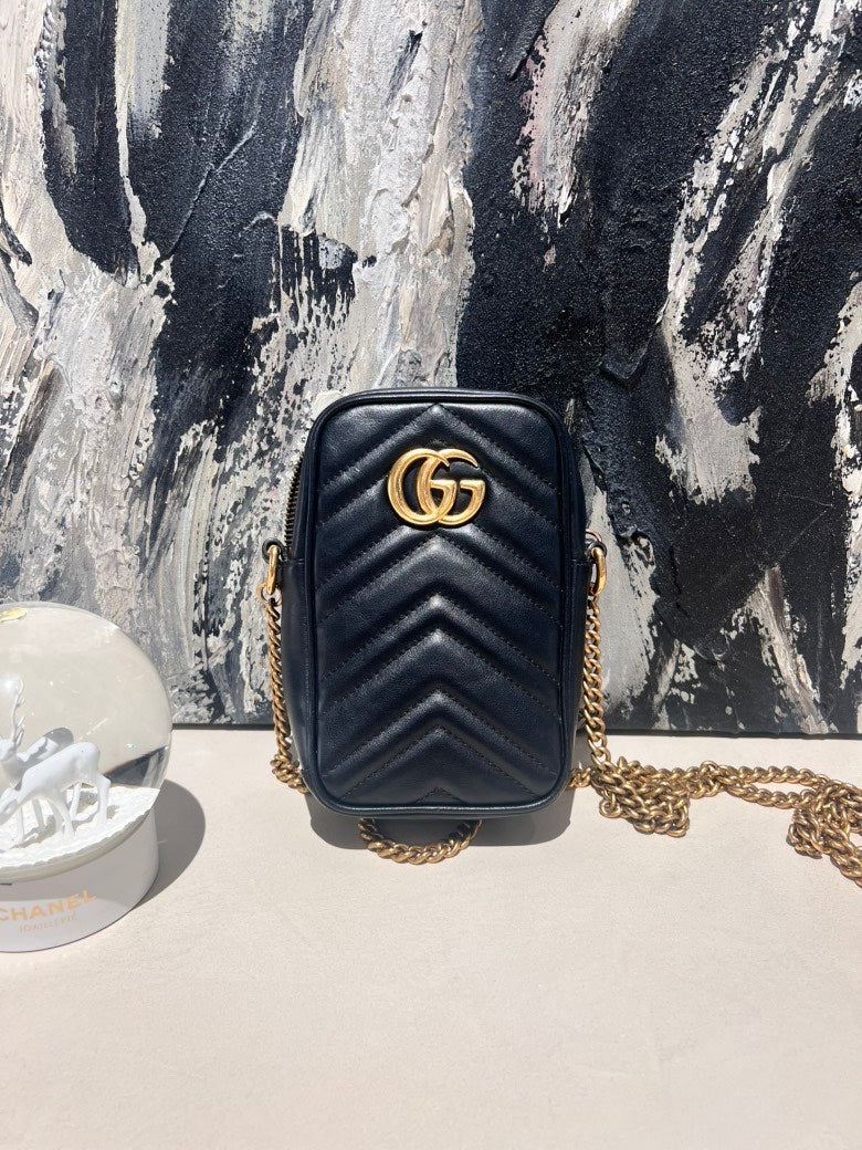   Gucci marmont cellphone bag.