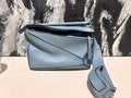   Loewe puzzle small blue.