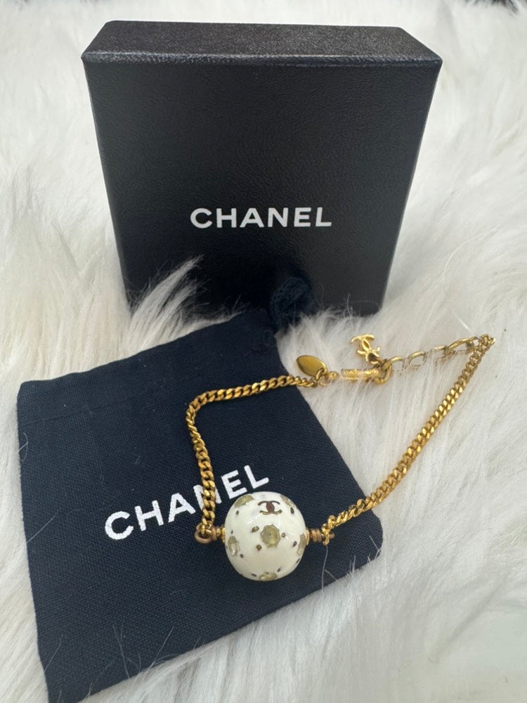 - vintage Chanel 98P gold-tone chain bracelet with a white CC logo ball charm
