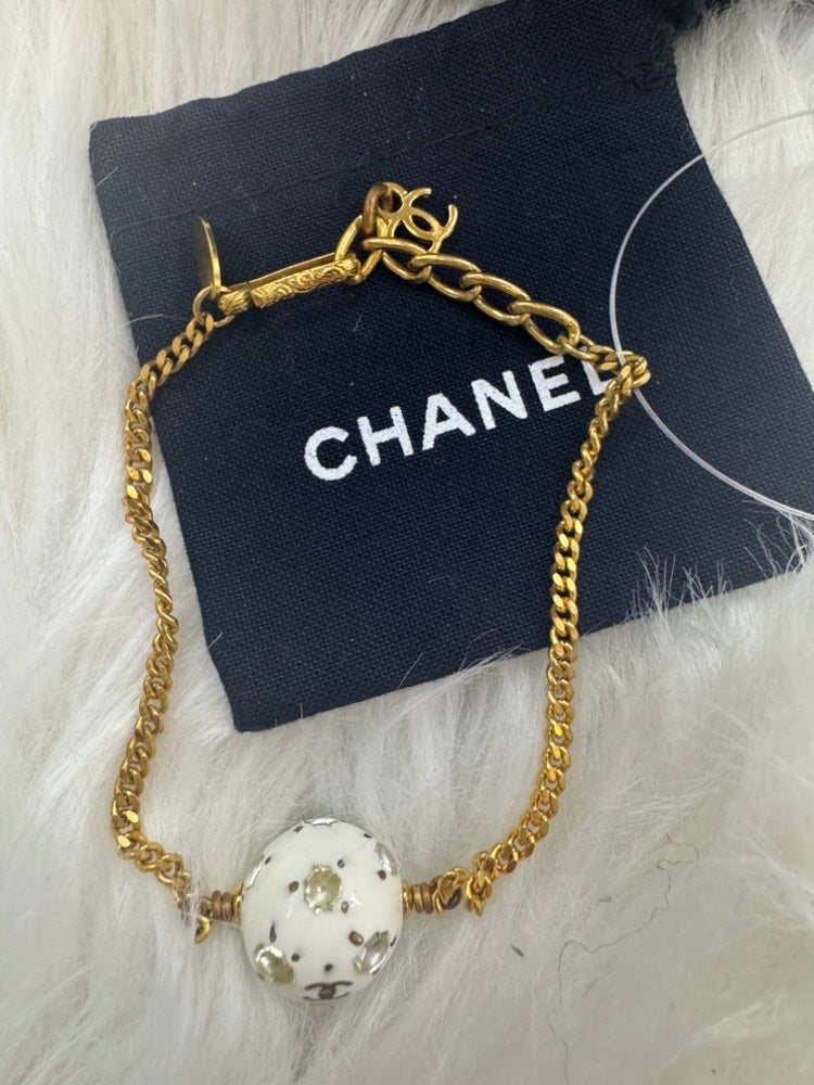 - vintage Chanel 98P gold-tone chain bracelet with a white CC logo ball charm