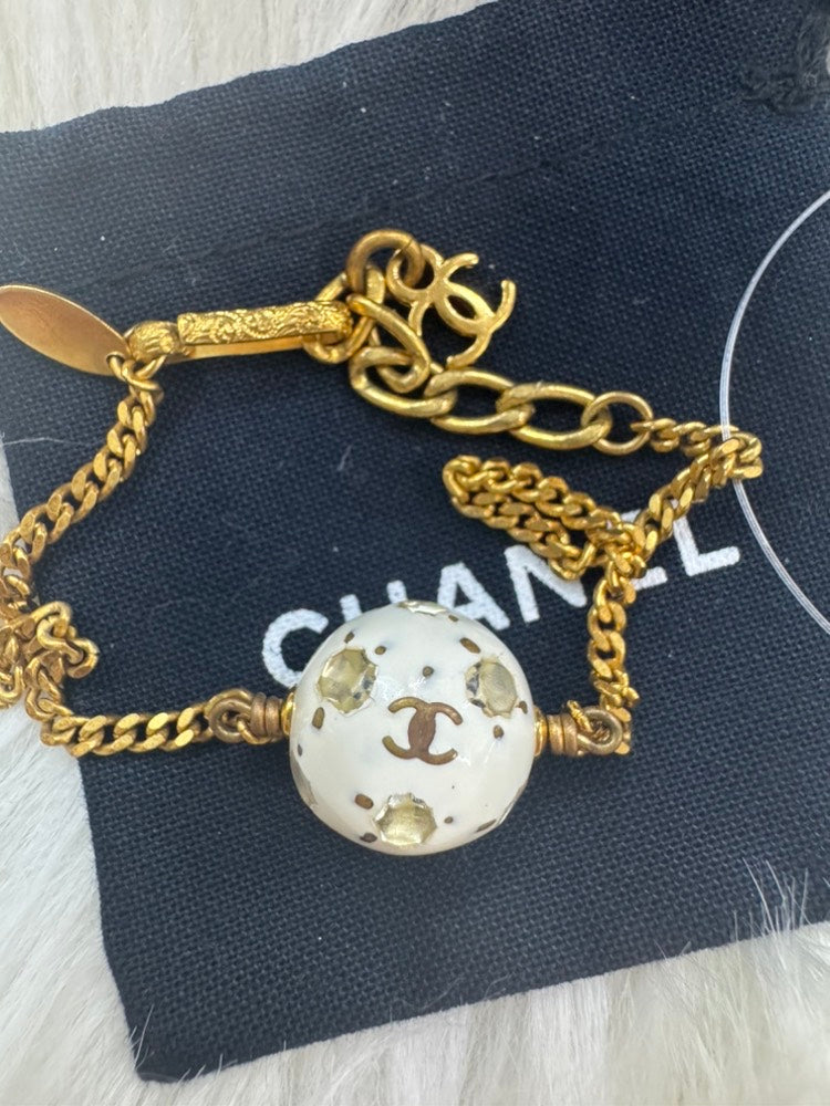 - vintage Chanel 98P gold-tone chain bracelet with a white CC logo ball charm