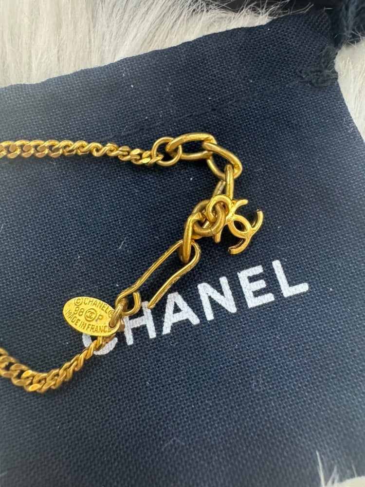 - vintage Chanel 98P gold-tone chain bracelet with a white CC logo ball charm