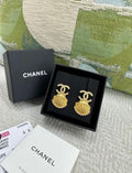 Chanel 23C gold shell earrings